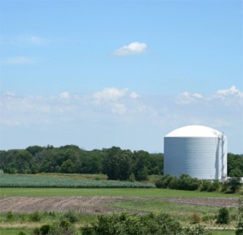 Farm field and sylo representing fertilizer industry